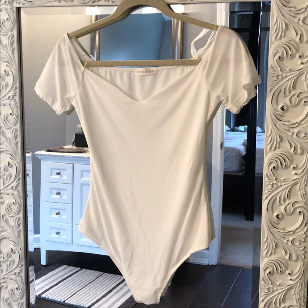 White body suit. Never worn (but tags removed)